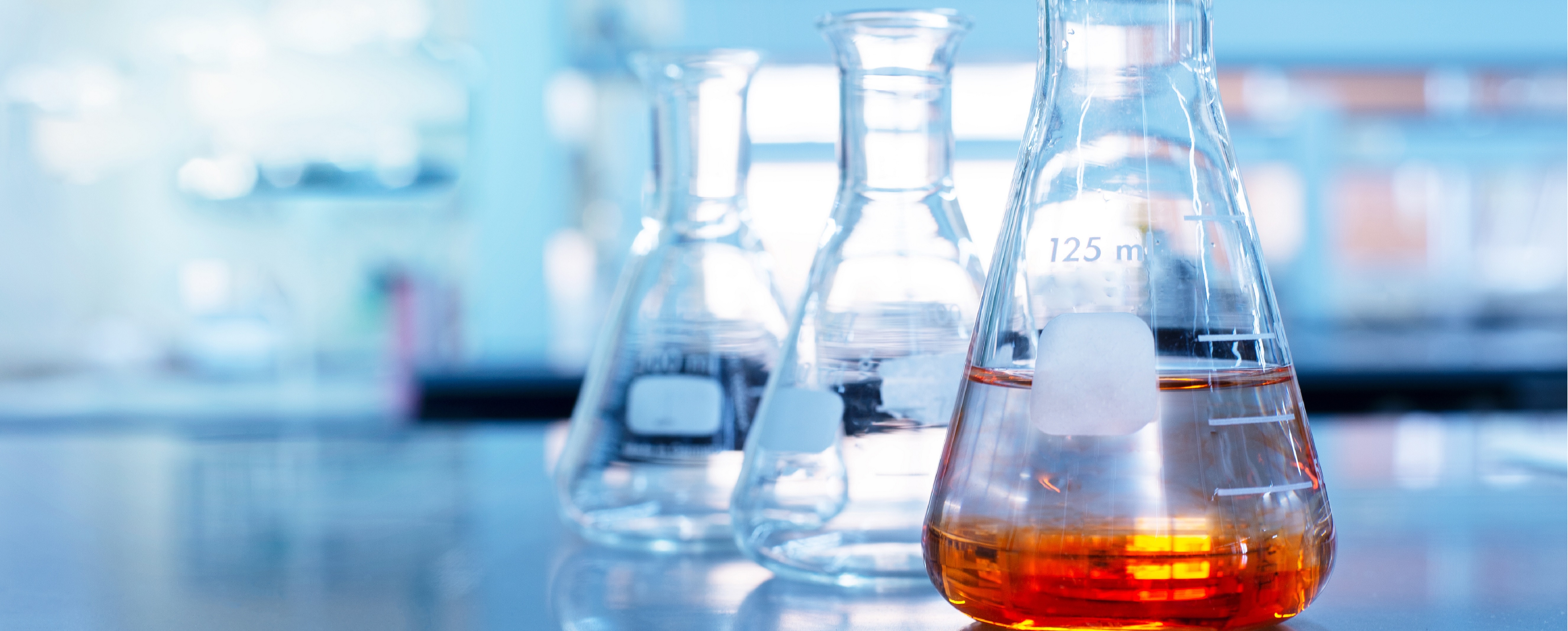 Specialty chemicals in flasks representing chemical process plant design capabilities